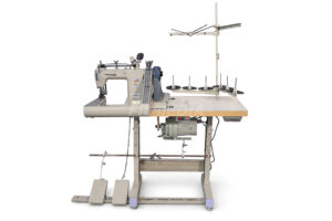 Read more about the article Three-needle Sewing Machine